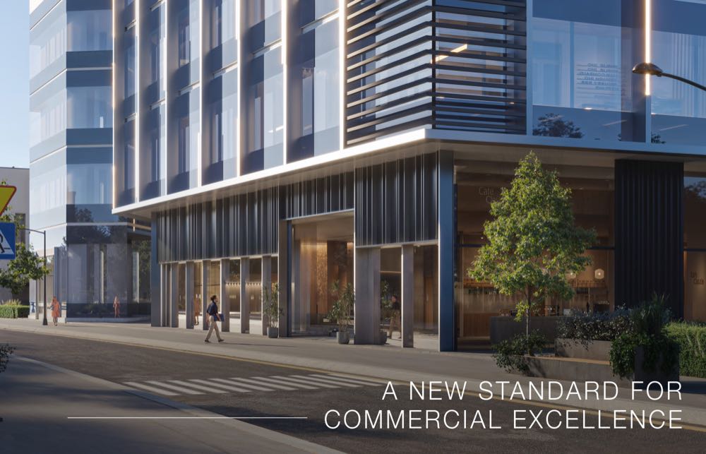 Street-level retail entrance with cafes and landscaping