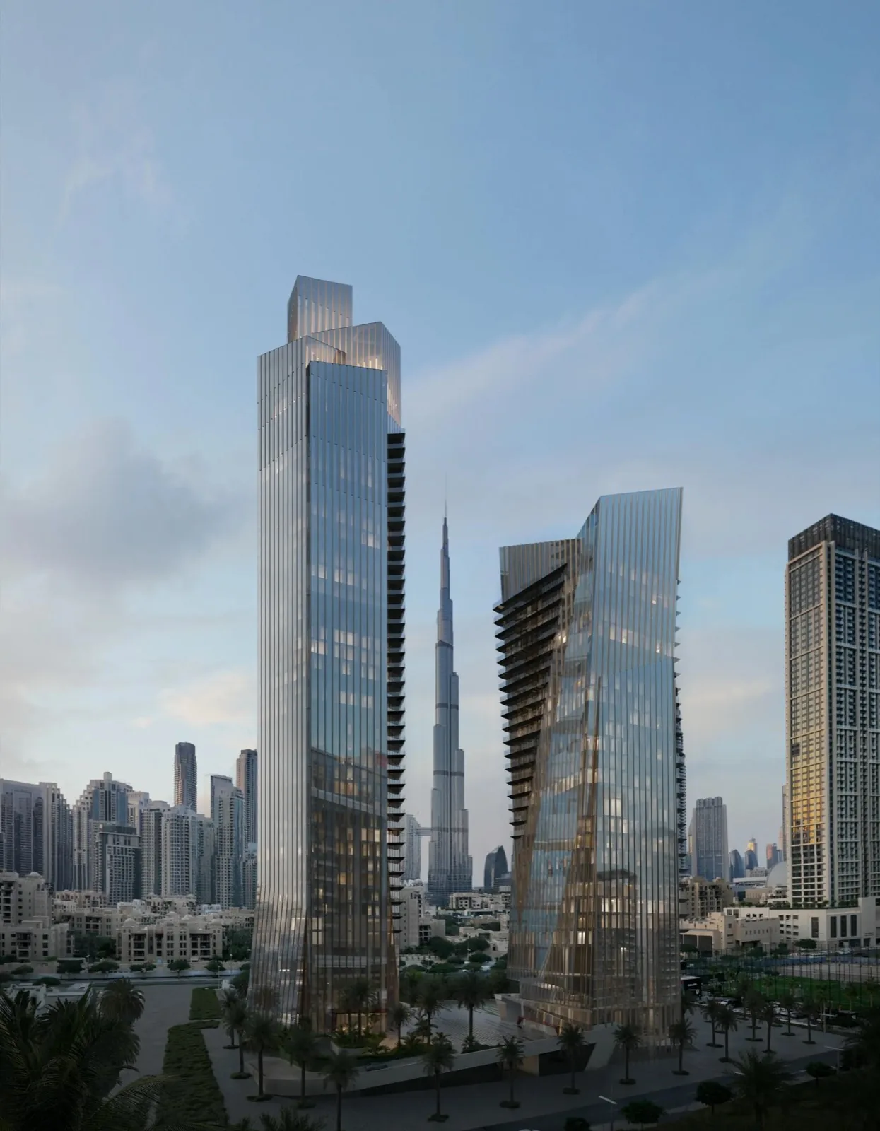 The two faceted glass Baccarat Hotel & Residences towers with the Burj Khalifa behind