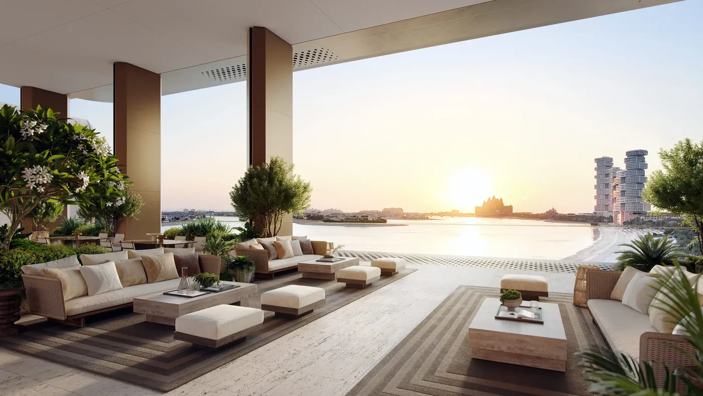 Covered terrace lounge at sunset overlooking the sea from The Alba Residences