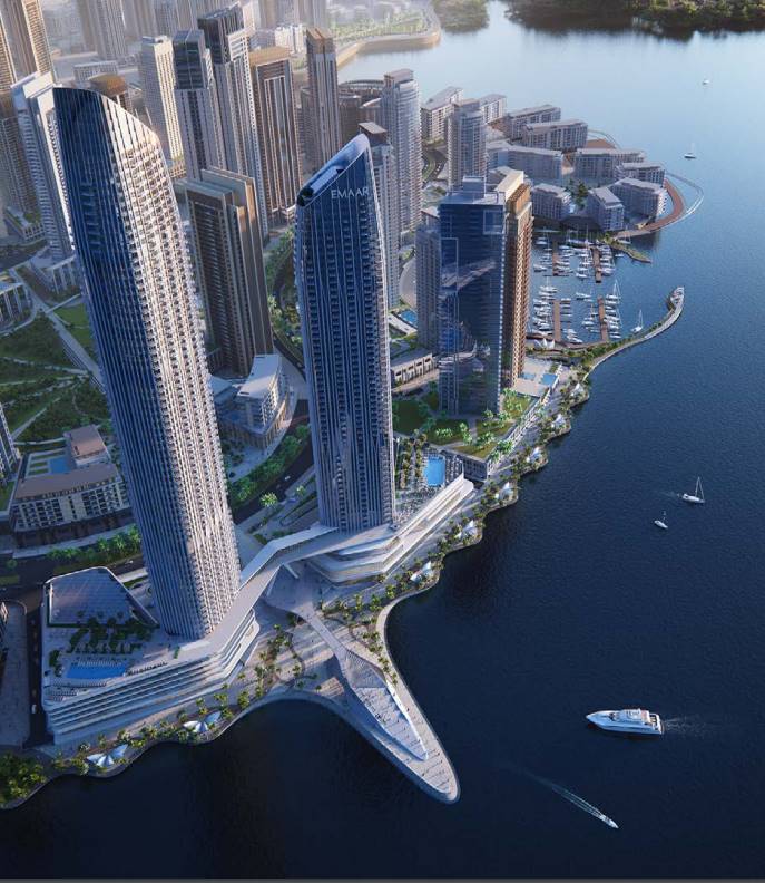 Aerial view of Dubai Creek Harbour with modern skyline and the new tower beside the glimmering creek