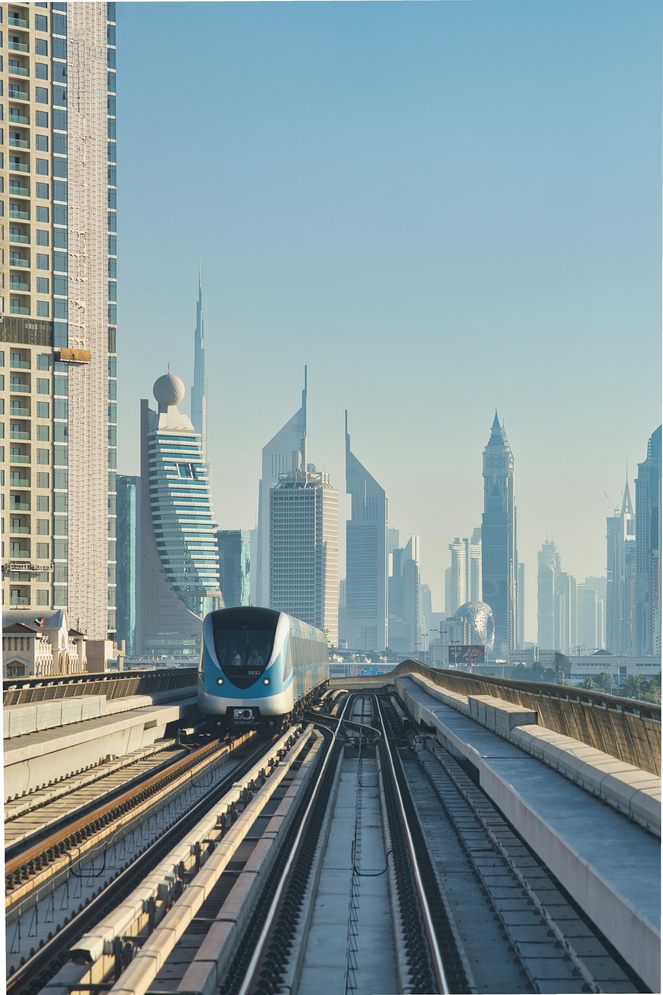 Dubai Metro train with city skyline - Dubai public transport network