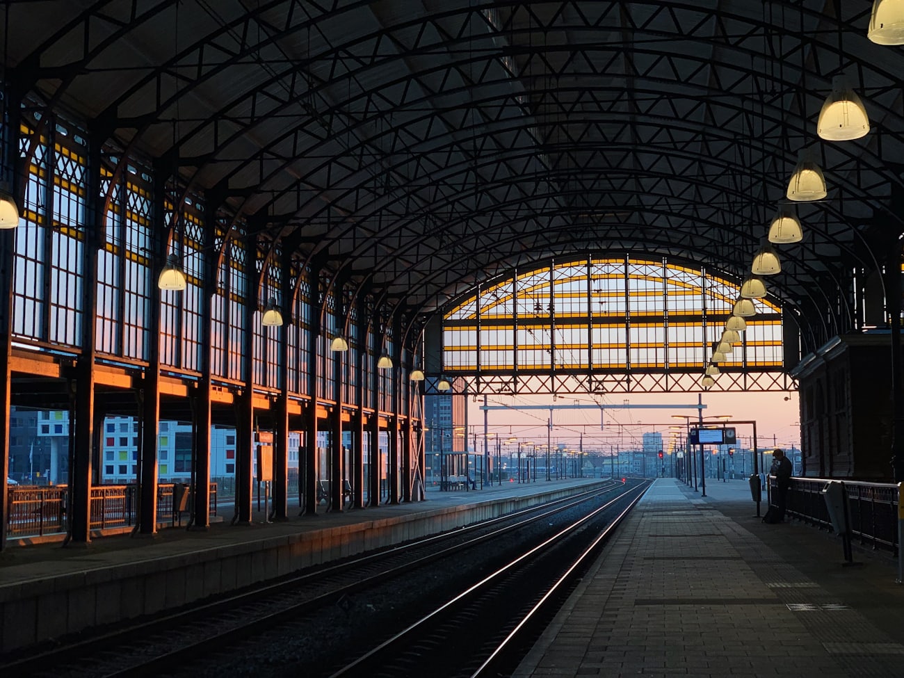 Modern railway station platform at sunset - Etihad Rail passenger network