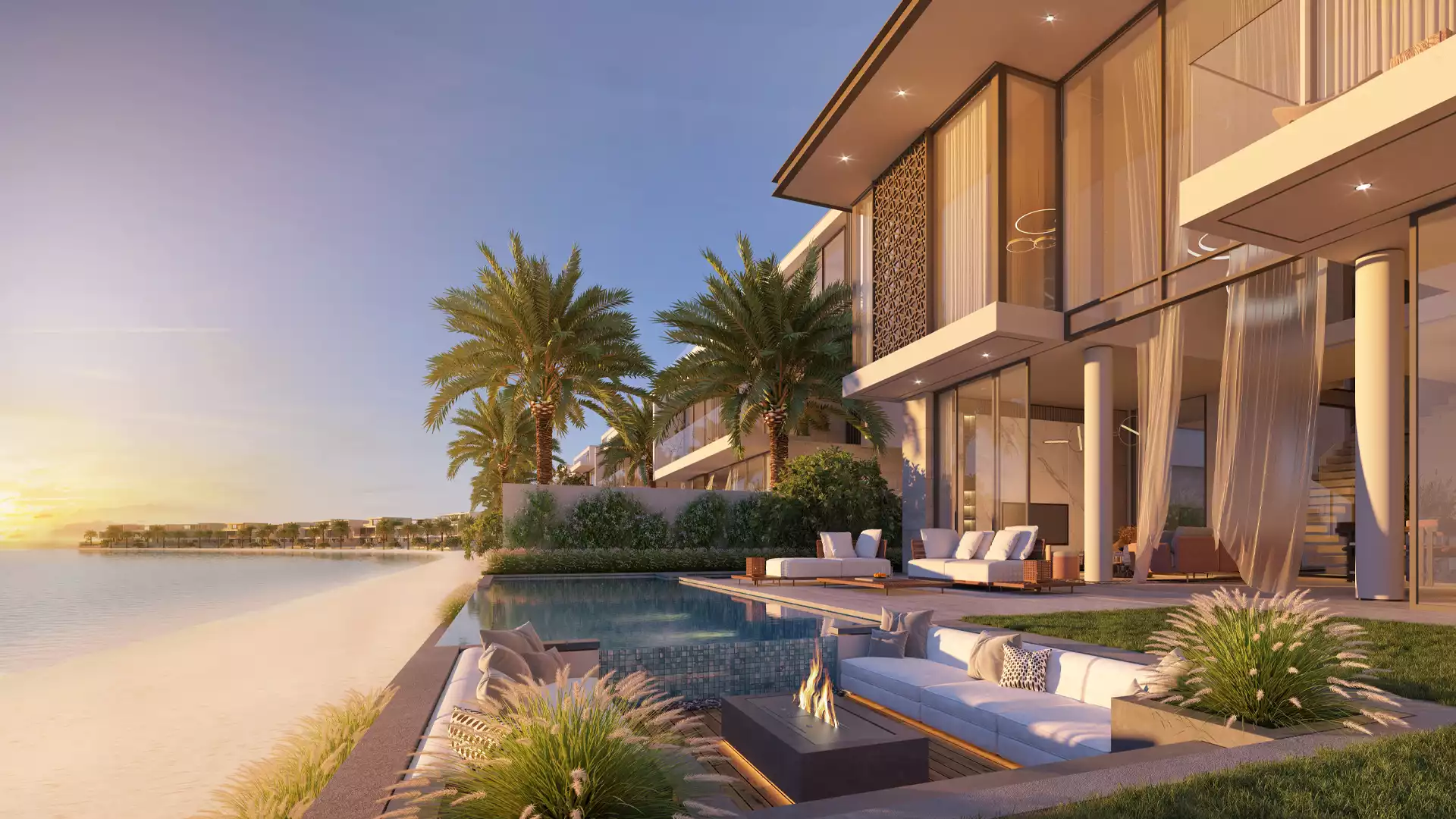 Beach Collection villa at sunset with infinity pool and fire pit on the beachfront